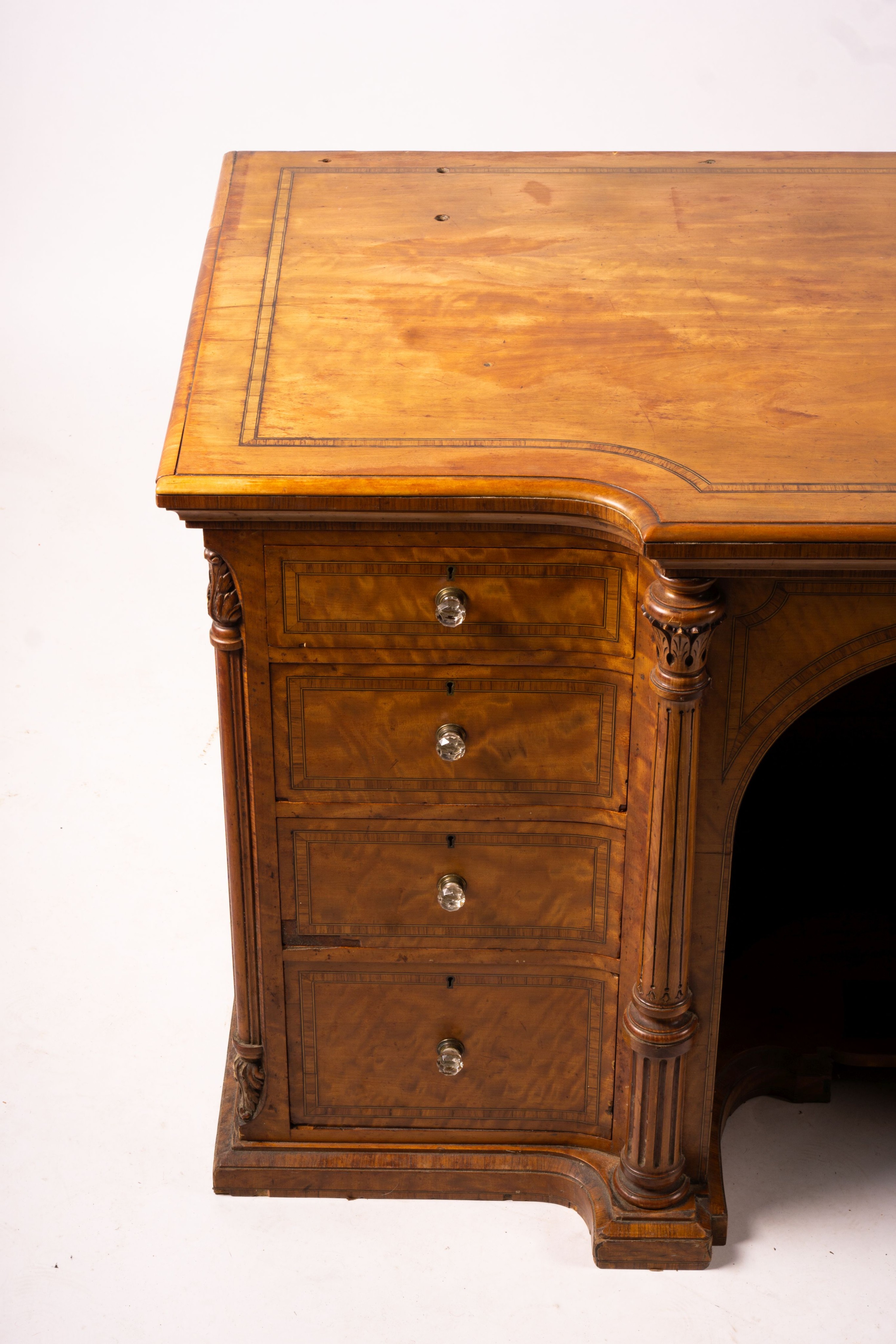 A late Victorian banded satinwood kneehole desk, width 138cm, depth 67cm, height 71cm